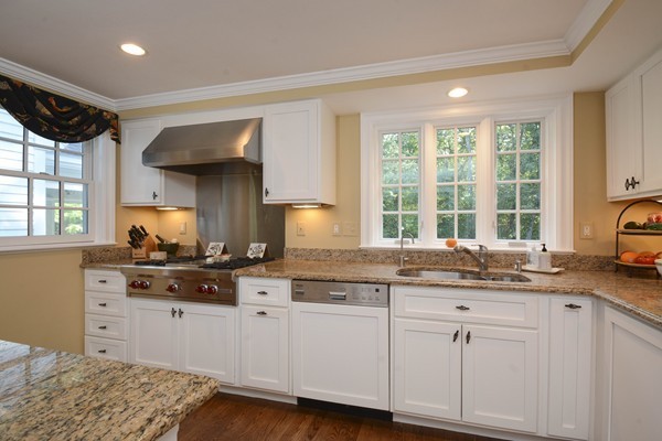 45 Falmouth Road Wellesley, MA 02481 - Photo 8 of 27 a kitchen with granite countertop a sink a window and cabinets