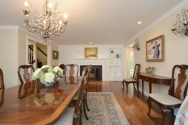 45 Falmouth Road Wellesley, MA 02481 - Photo 10 of 27 a view of a dining room with furniture a chandelier and wooden floor