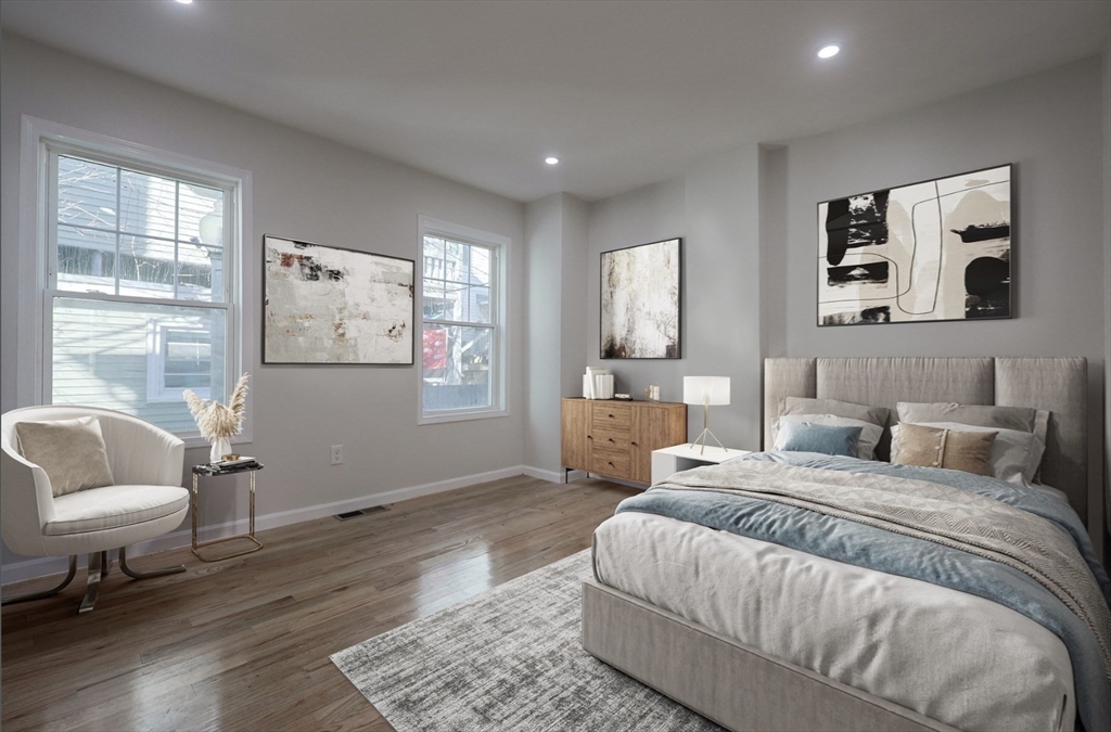3 Appian Place Boston, MA 02128 - Photo 4 of 15 a spacious bedroom with a bed and wooden floor