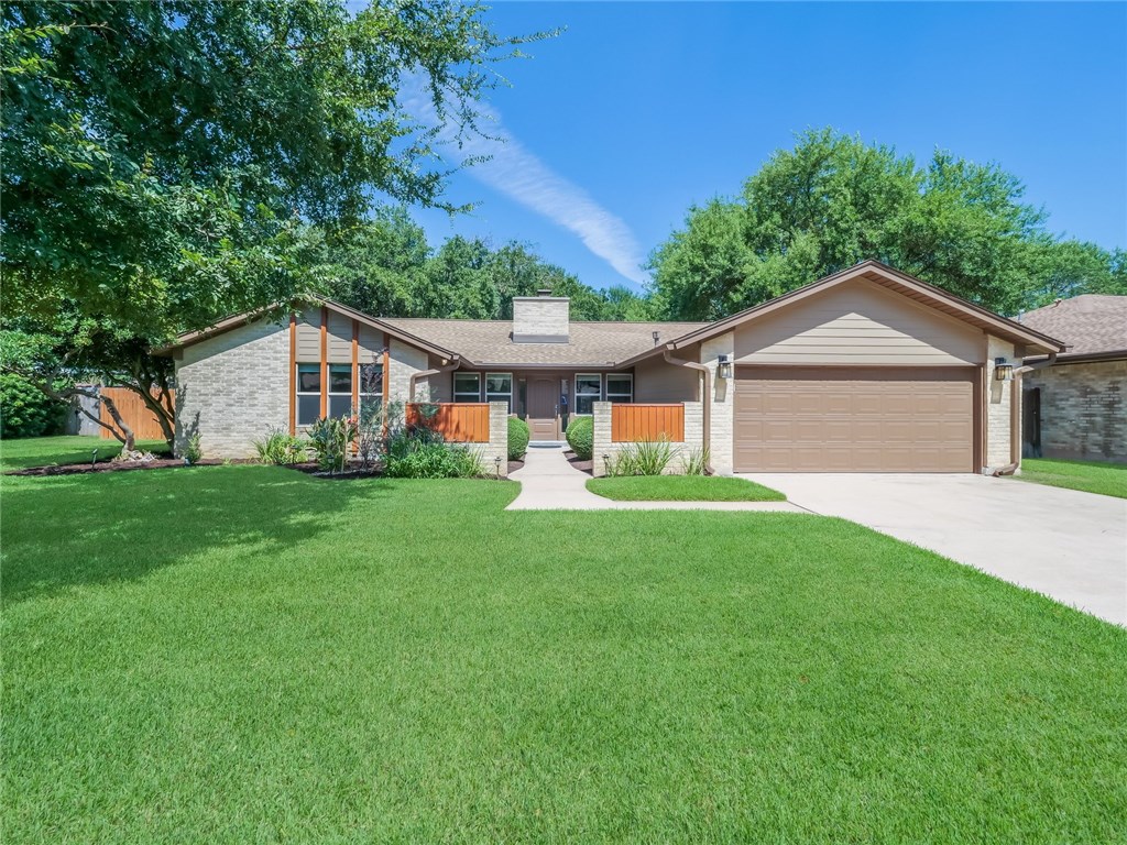 11808 Buckingham Road Austin, TX 78759 - Photo 1 of 1 a view of a house with a yard plants and large tree