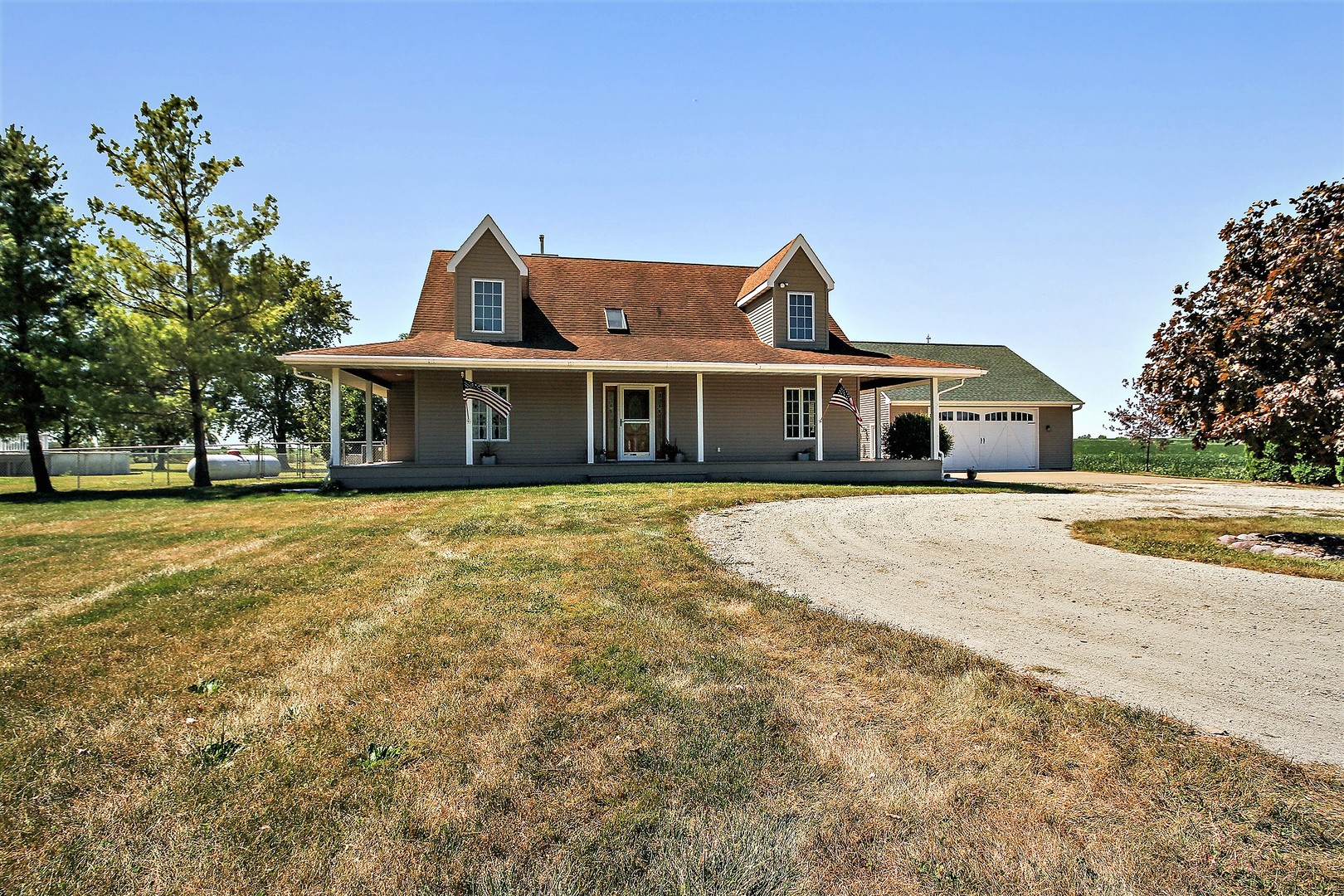 2068 East 7750S Road Chebanse, IL 60922 - Photo 1 of 24 a front view of a house with a garden