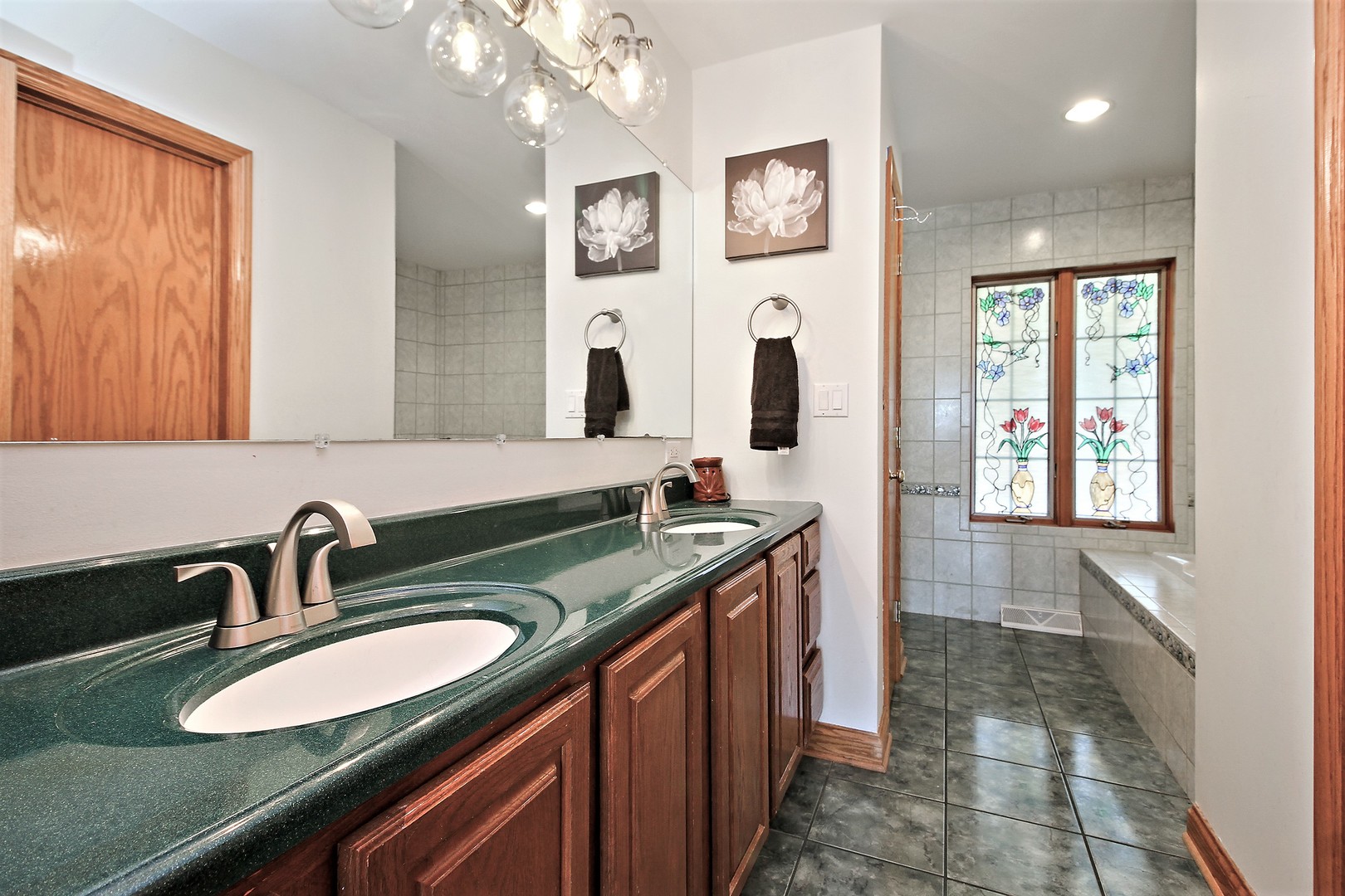 2068 East 7750S Road Chebanse, IL 60922 - Photo 13 of 24 a bathroom with double vanity sink and a mirror
