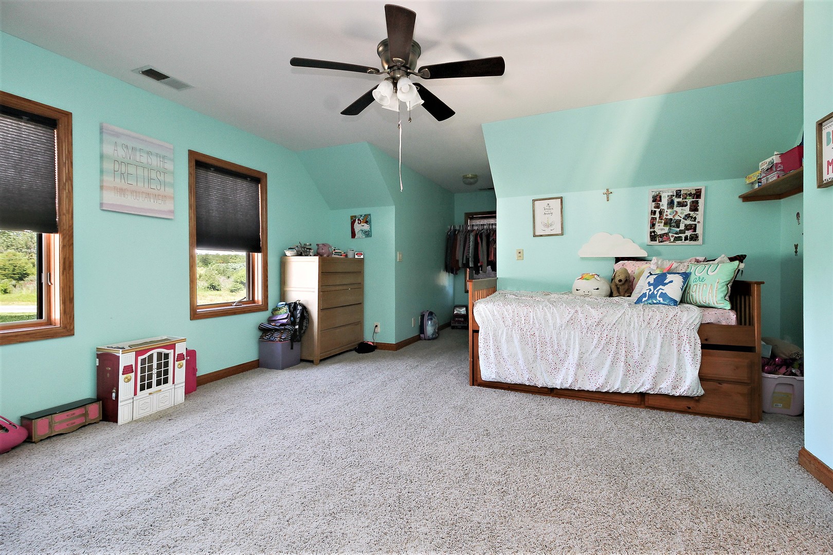 2068 East 7750S Road Chebanse, IL 60922 - Photo 15 of 24 a bedroom with bed and a chandelier