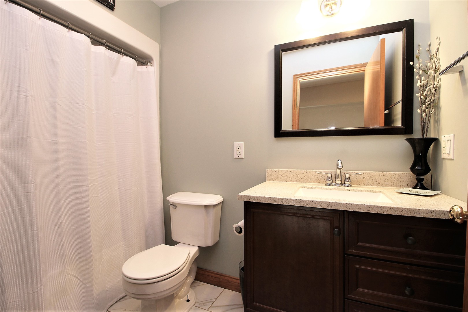 2068 East 7750S Road Chebanse, IL 60922 - Photo 17 of 24 a bathroom with a toilet sink and mirror