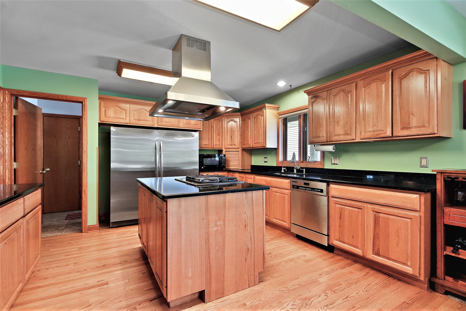 2068 East 7750S Road Chebanse, IL 60922 - Photo 10 of 24 a kitchen with stainless steel appliances granite countertop a stove and a refrigerator
