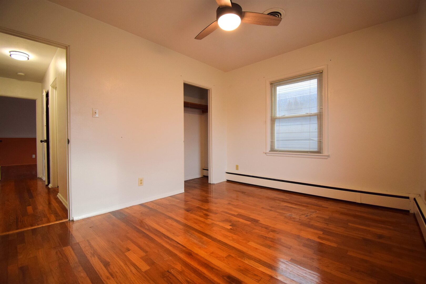 3109 Peach Street Mount Vernon, IL 62864 - Photo 14 of 29 an empty room with wooden floor and windows
