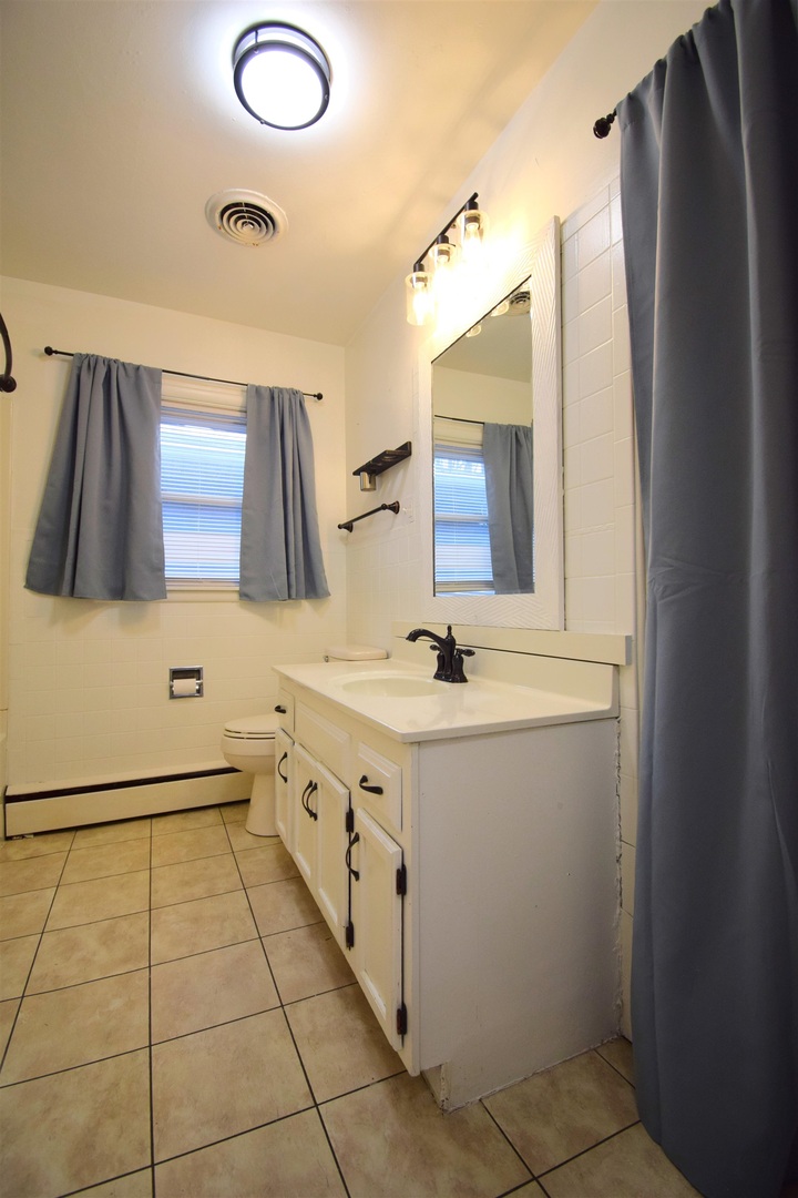 3109 Peach Street Mount Vernon, IL 62864 - Photo 15 of 29 a bathroom with a sink and a mirror
