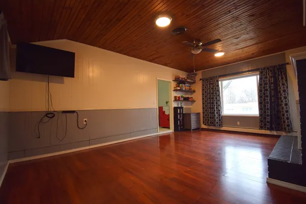 a view of a livingroom with wooden floor