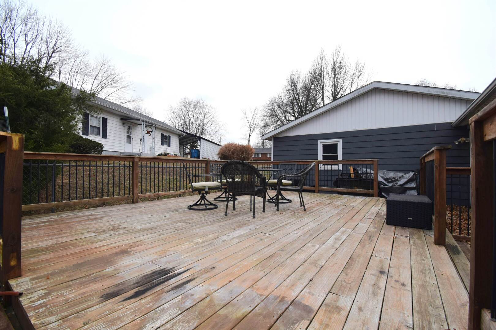 3109 Peach Street Mount Vernon, IL 62864 - Photo 28 of 29 a view of a roof deck with table and chairs wooden floor and fence