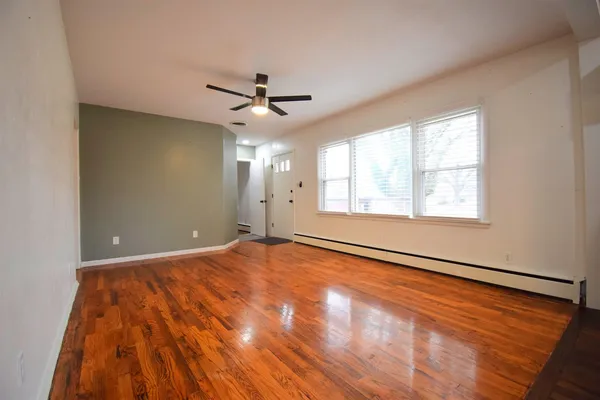 a view of an empty room and a window