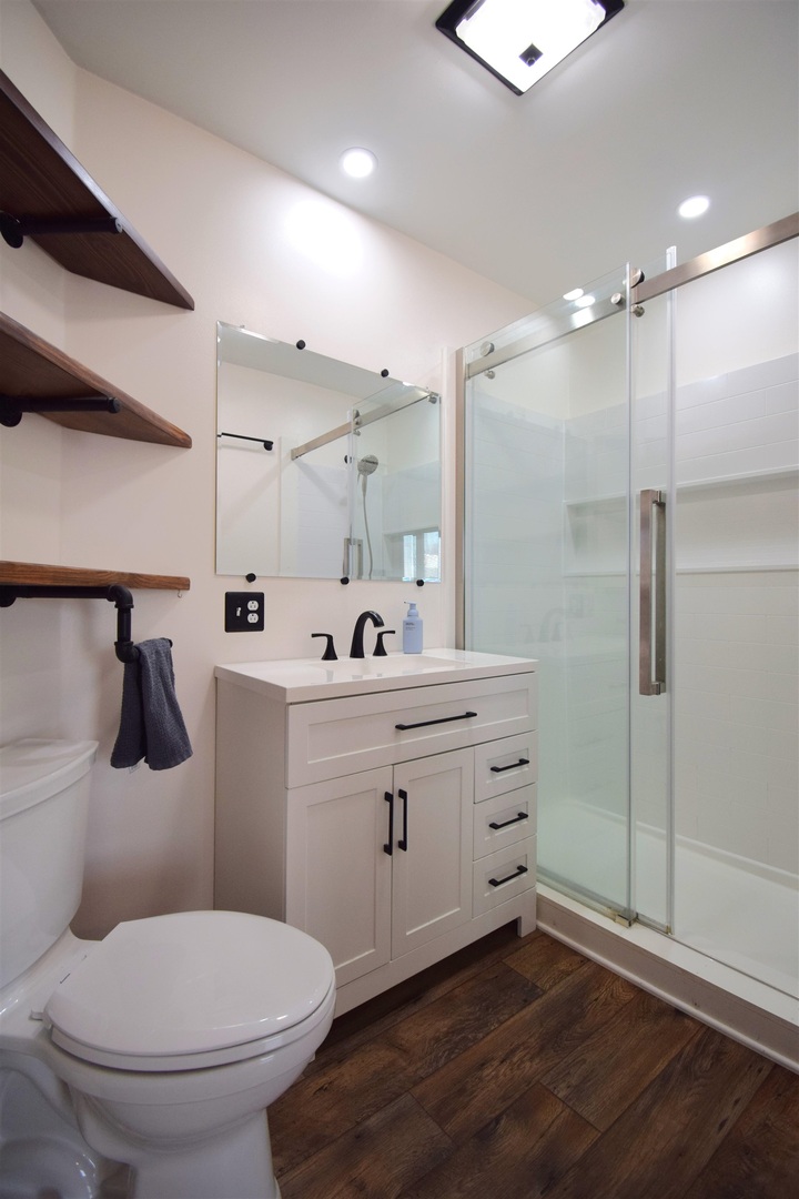 3109 Peach Street Mount Vernon, IL 62864 - Photo 10 of 29 a bathroom with a sink a toilet a mirror and shower