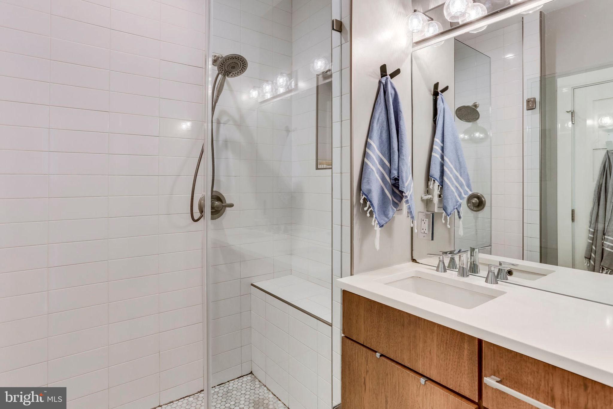 963 14th Street Southeast, Unit 1 Washington, DC 20003 - Photo 54 of 83 Master en suite bath with Carrara marble shower
