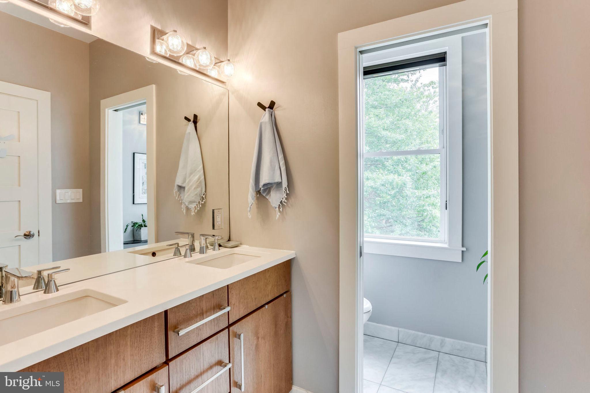 963 14th Street Southeast, Unit 1 Washington, DC 20003 - Photo 55 of 83 Mater en suite bathroom