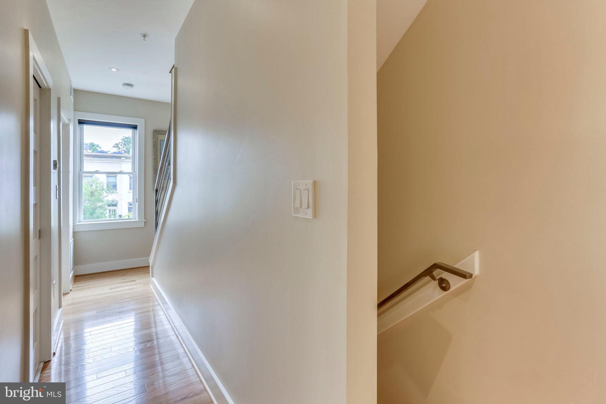 963 14th Street Southeast, Unit 1 Washington, DC 20003 - Photo 59 of 83 3rd level hallway to laundry closet
