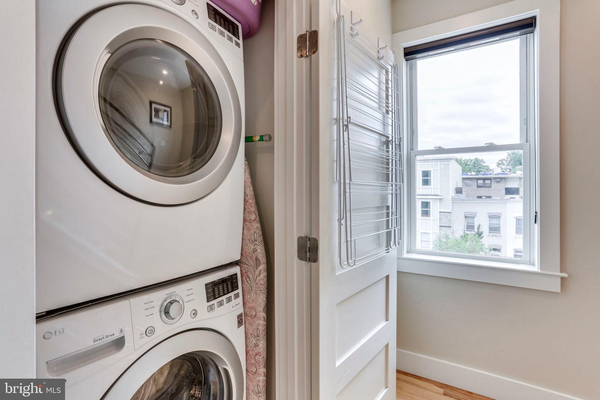 963 14th Street Southeast, Unit 1 Washington, DC 20003 - Photo 60 of 83 Laundry closet with front load washer/dryer