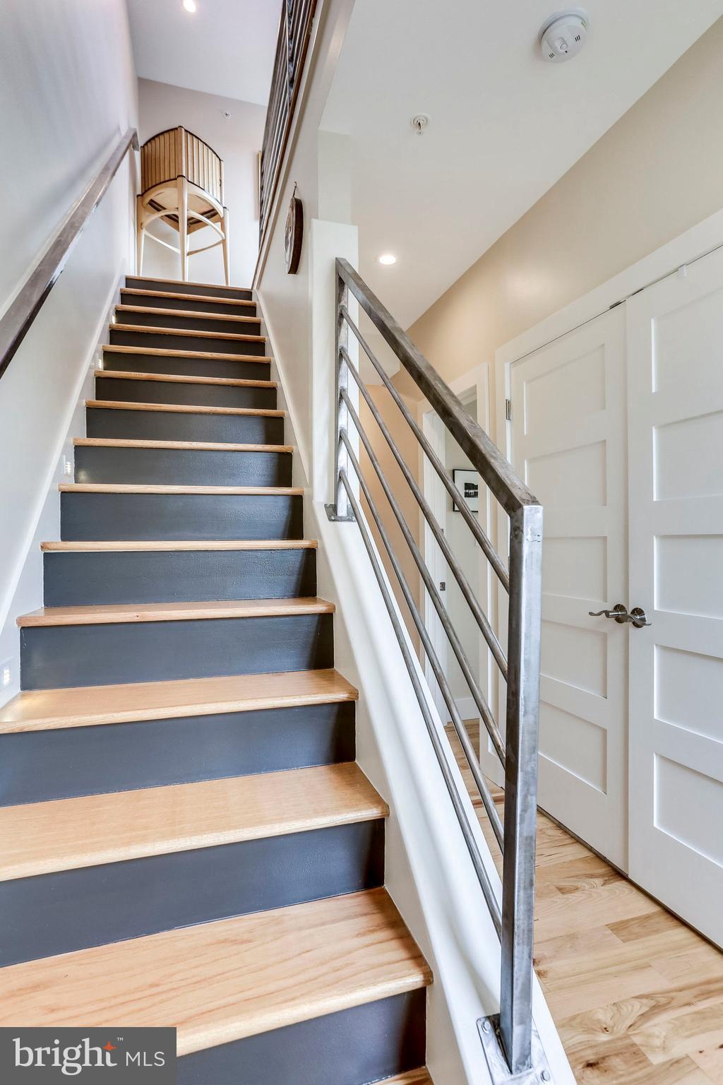 963 14th Street Southeast, Unit 1 Washington, DC 20003 - Photo 61 of 83 Stairway to roof deck and wet bar