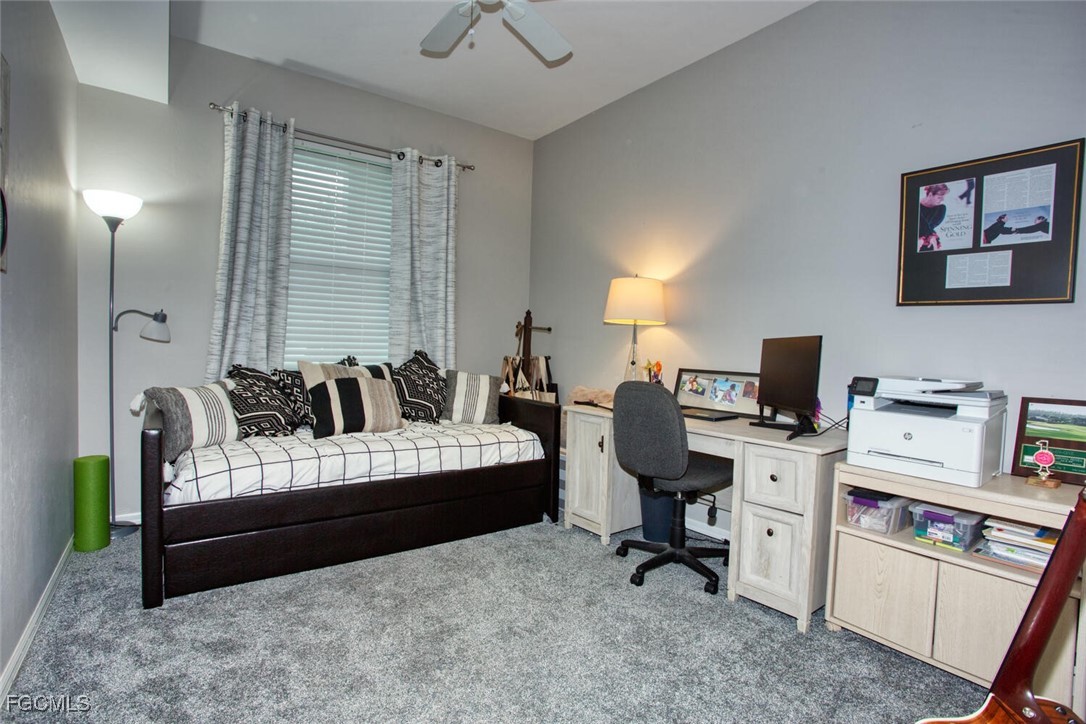8076 Queen Palm Lane, Unit 416 Fort Myers, FL 33966 - Photo 11 of 18 a bedroom with a workspace