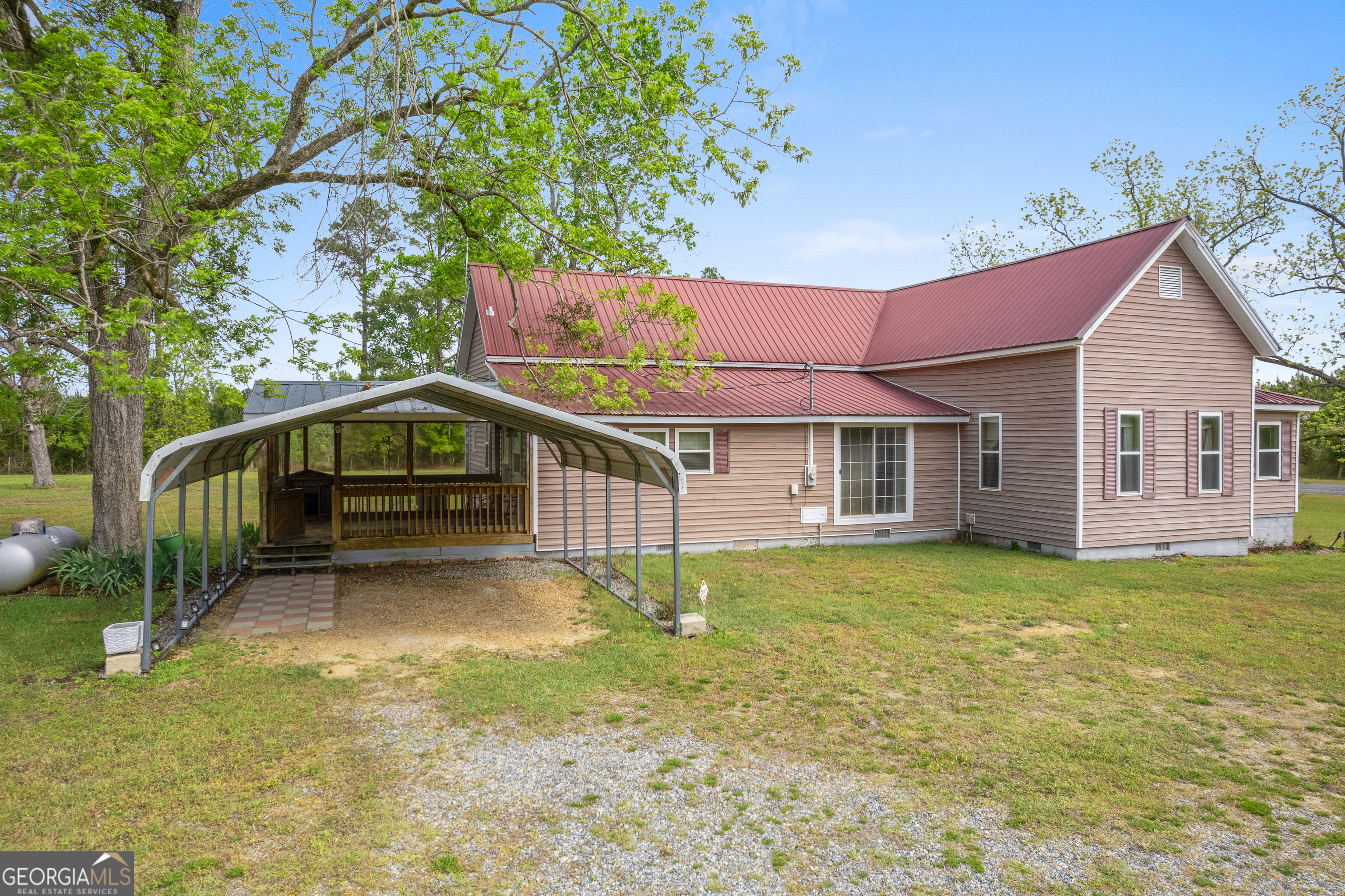 2010 Page Road Harrison, GA 31035 - Photo 6 of 59 a house view with a garden space