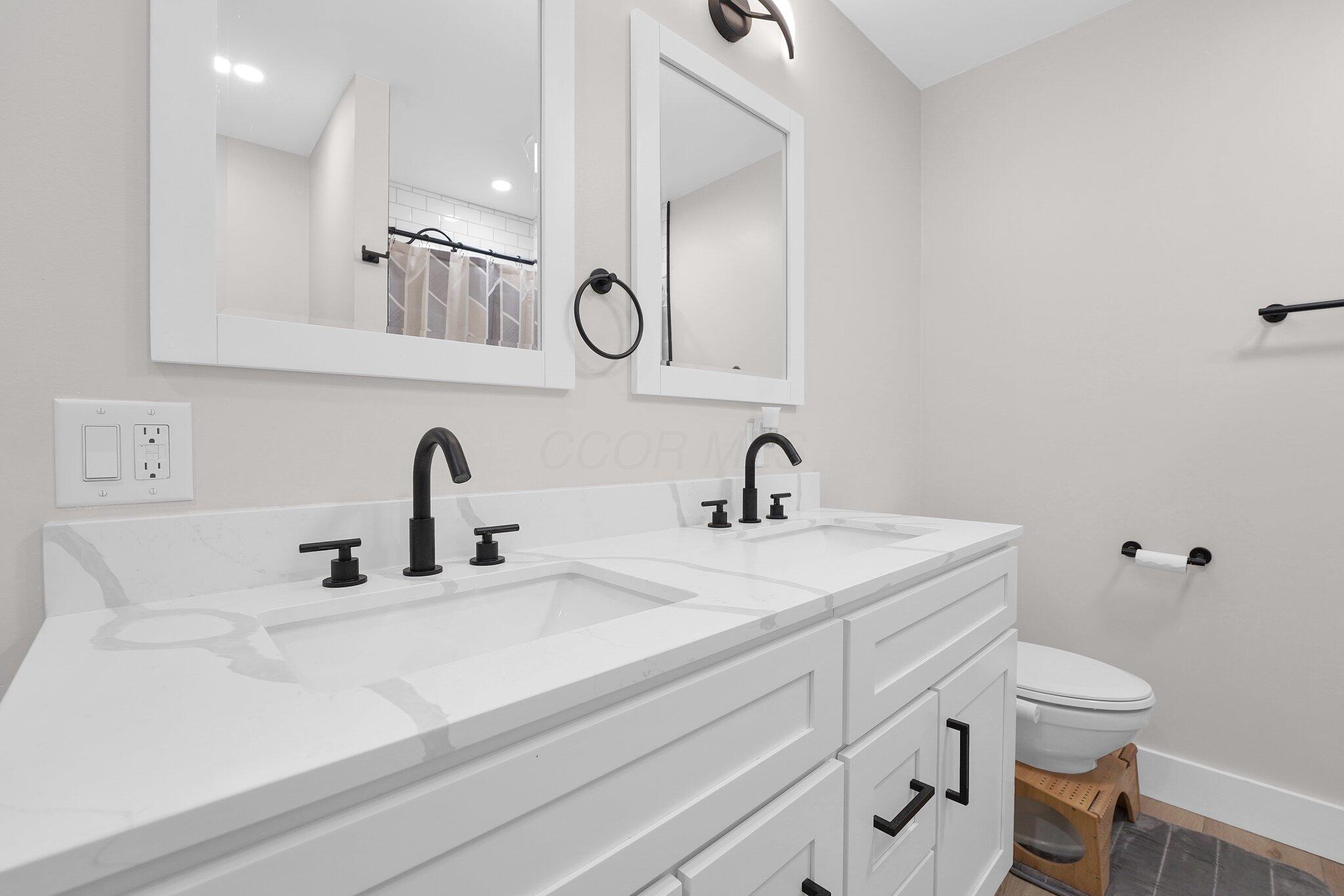 5524 Cosgray Road Dublin, OH 43016 - Photo 18 of 35 Owner bath features dual vanity and recently updated shower with subway tile