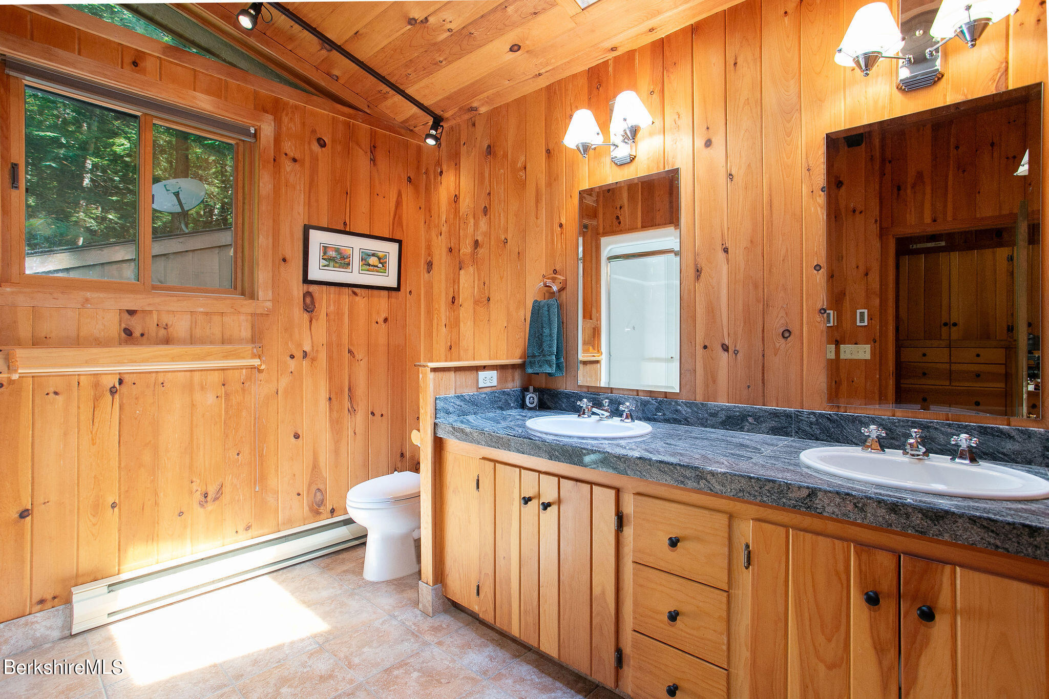 266 Moberg Road Becket, MA 01223 - Photo 18 of 41 a spacious bathroom with a granite countertop sink and a mirror