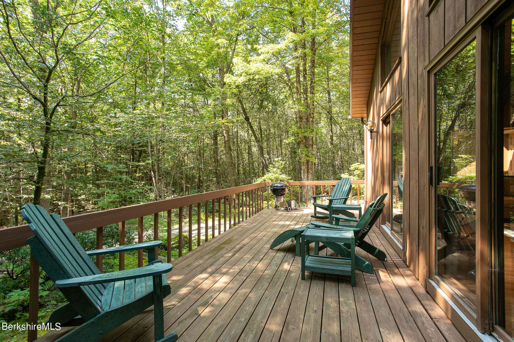 266 Moberg Road Becket, MA 01223 - Photo 29 of 41 a view of balcony with wooden floor and outdoor seating