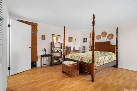 a bedroom with a bed and a table