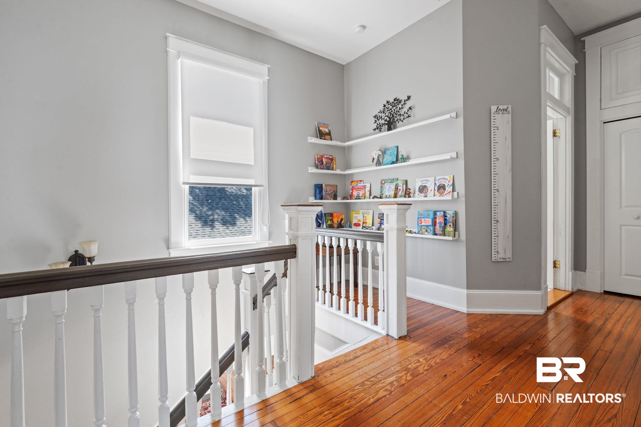 10 South Monterey Street Mobile, AL 36604 - Photo 20 of 45 Hallway with hardwood / wood-style floors and an upstairs landing