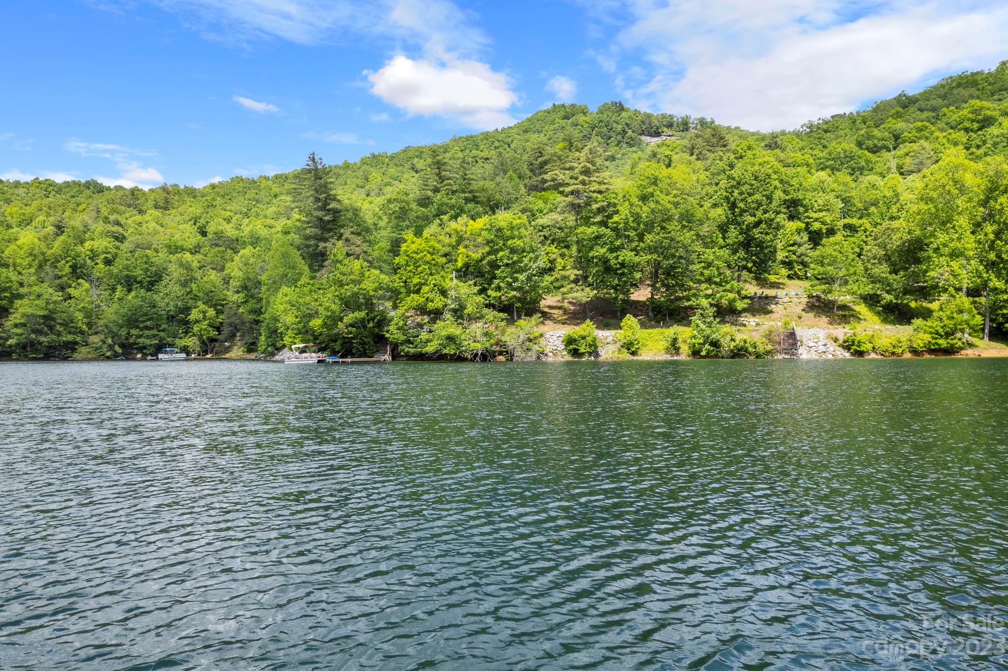 Tbd Vess Owens Road, Unit LOT 4B Tuckasegee, NC 28783 - Photo 15 of 18 a view of a lake with a yard