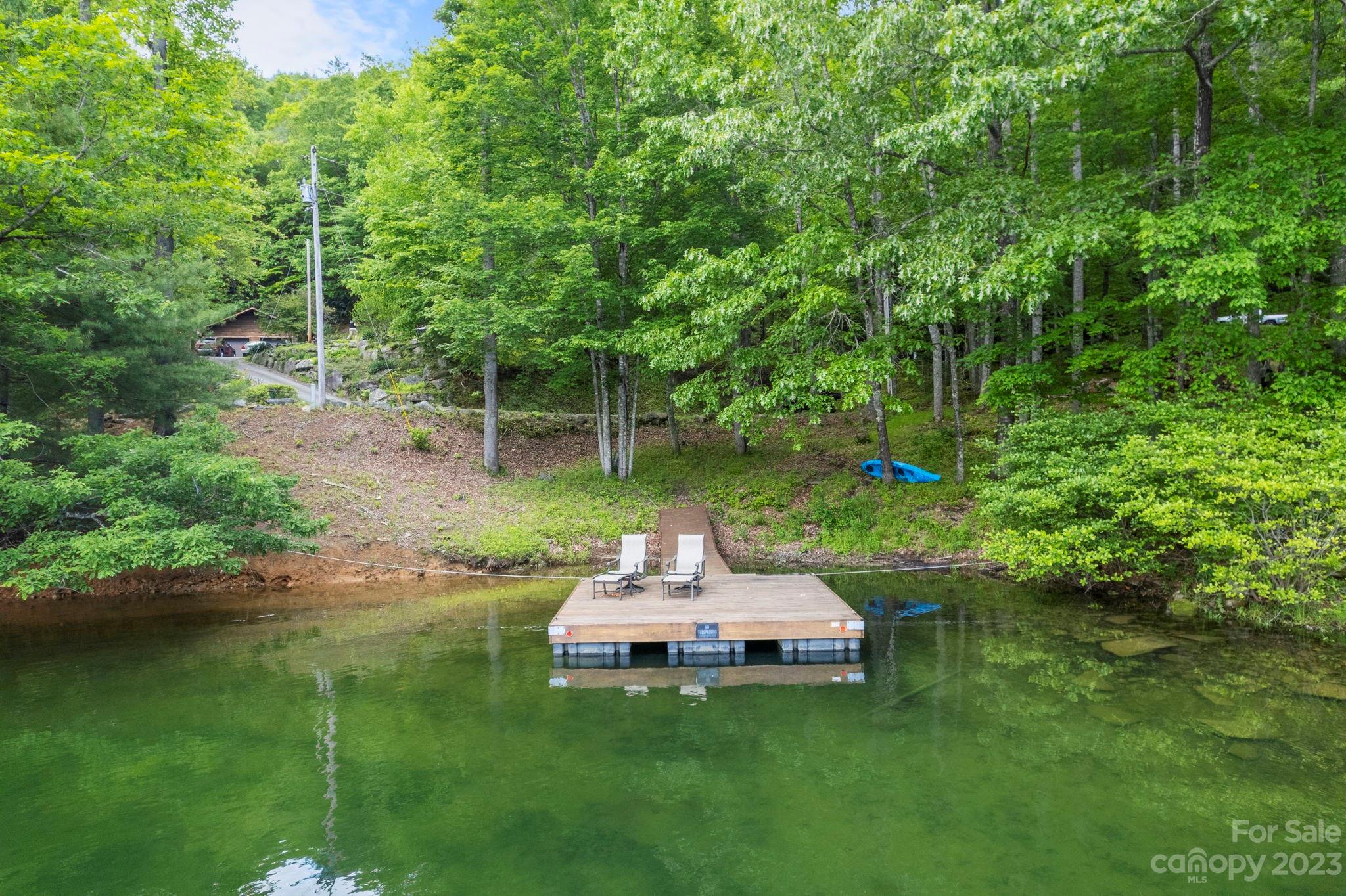 Tbd Vess Owens Road, Unit LOT 4B Tuckasegee, NC 28783 - Photo 4 of 18 a backyard of a house with table and chairs