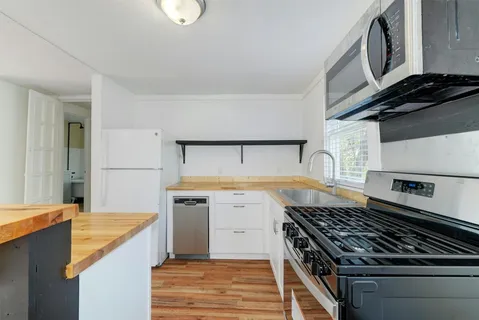 a kitchen with a stove and a sink
