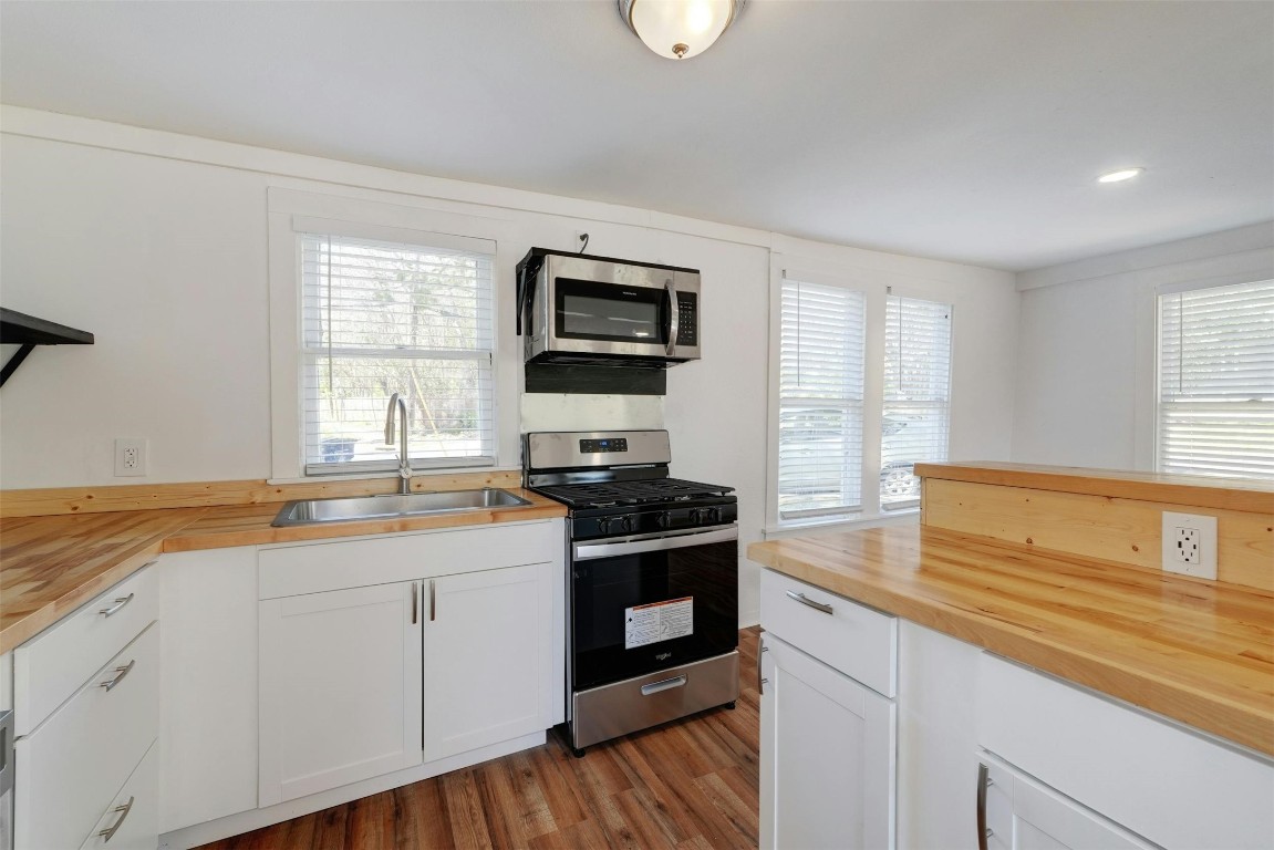 1401 Windsor Road Austin, TX 78703 - Photo 13 of 20 a kitchen with a sink stove and microwave