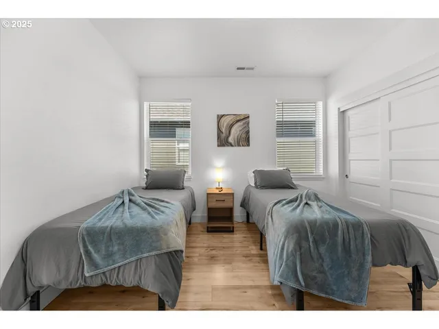 a bedroom with furniture and a window