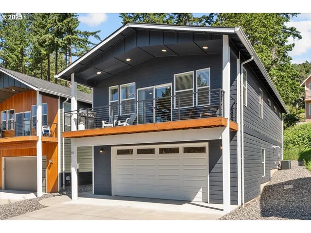 a front view of a house with a garage
