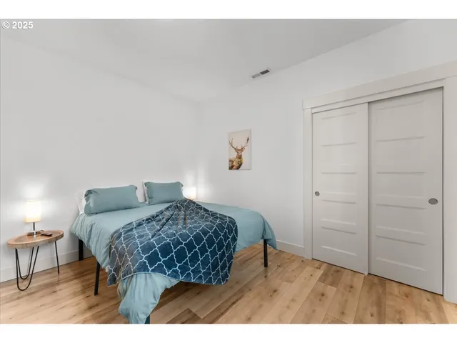 a bedroom with a bed and a table