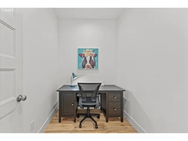 a view of a workspace with furniture