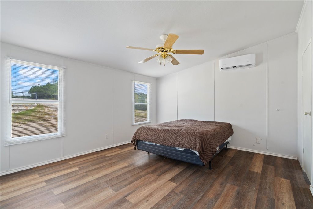10500 Tarantula Court Leander, TX 78641 - Photo 11 of 34 a living room with a bed furniture and a window