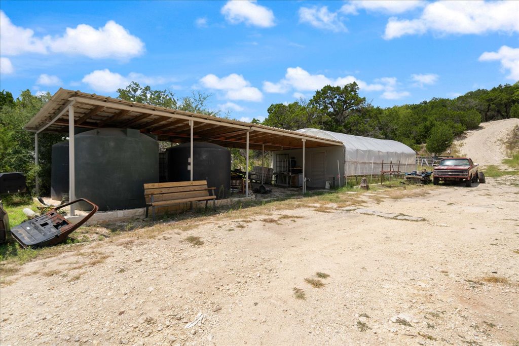 10500 Tarantula Court Leander, TX 78641 - Photo 29 of 34 a view of a chair and tables in the patio