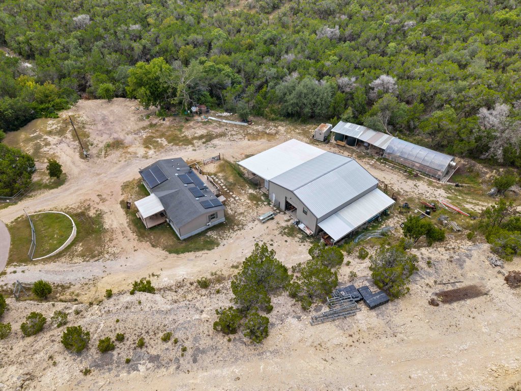 10500 Tarantula Court Leander, TX 78641 - Photo 32 of 34 an aerial view of a house with yard and greenery