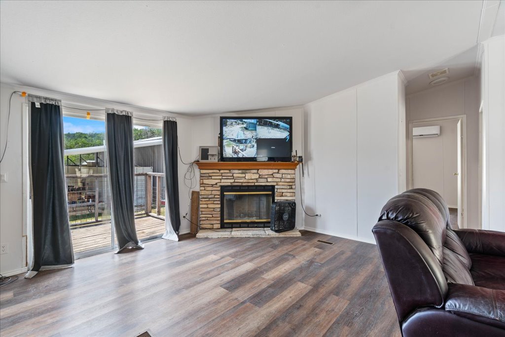 10500 Tarantula Court Leander, TX 78641 - Photo 7 of 34 a living room with furniture and a fireplace