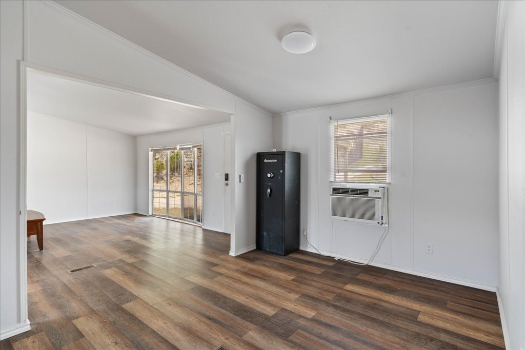 10500 Tarantula Court Leander, TX 78641 - Photo 9 of 34 a view of empty room with wooden floor and window