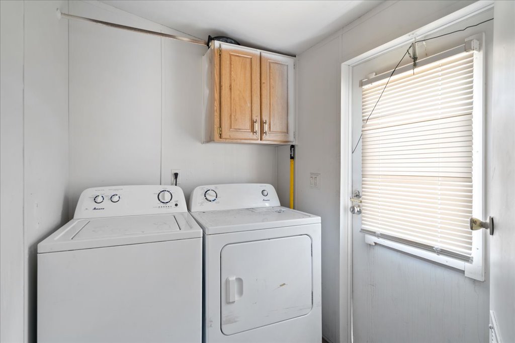 10500 Tarantula Court Leander, TX 78641 - Photo 10 of 34 a view of storage and utility room with washer and dryer