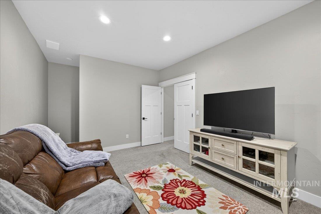 15111 Pinehurst Way Caldwell, ID 83607 - Photo 28 of 43 Living area with light colored carpet and recessed lighting