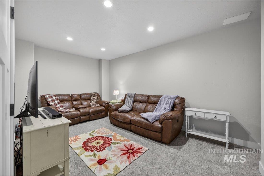 15111 Pinehurst Way Caldwell, ID 83607 - Photo 29 of 43 Living area featuring carpet and recessed lighting