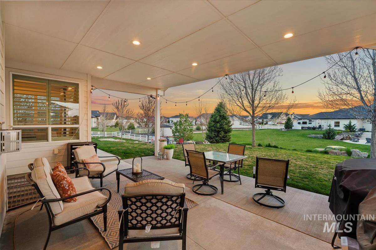 15111 Pinehurst Way Caldwell, ID 83607 - Photo 34 of 43 Patio terrace at dusk with a patio, a residential view, an outdoor living / dining area, and grilling area