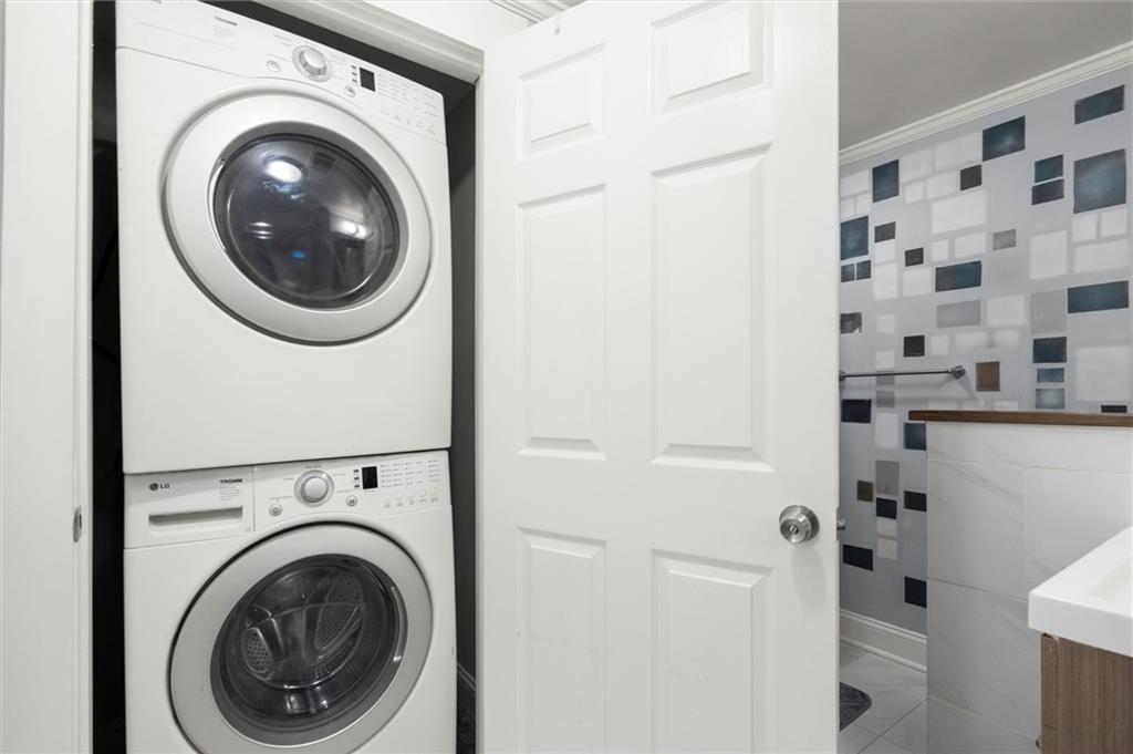 153 Randolph Street Northeast, Unit B Atlanta, GA 30312 - Photo 18 of 22 a view of a hallway with washer and dryer