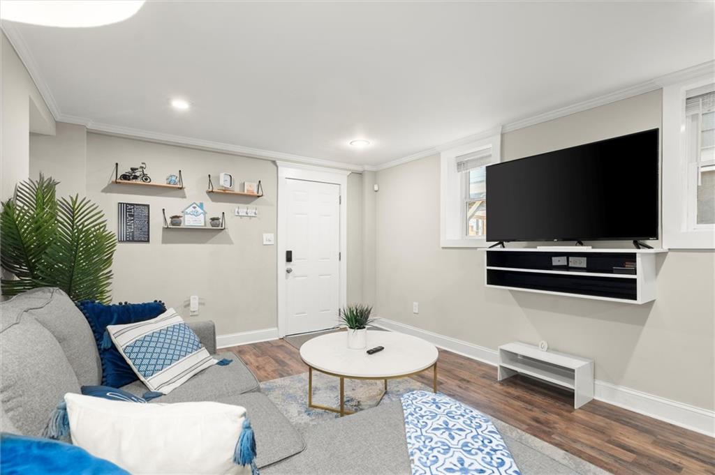 153 Randolph Street Northeast, Unit B Atlanta, GA 30312 - Photo 6 of 22 a living room with furniture and a flat screen tv