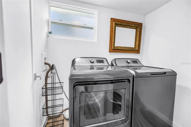 a utility room with dryer and washer