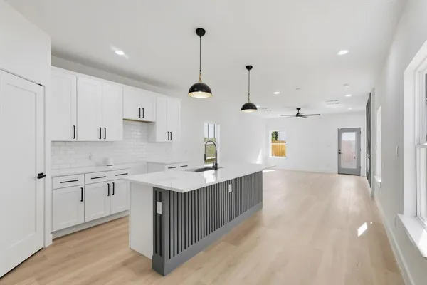 a kitchen with a sink counter top space and appliances