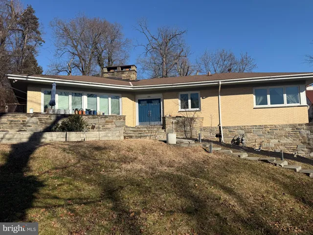 a front view of a house with yard