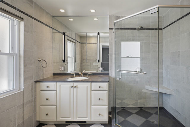 918 Lee Road Northbrook, IL 60062 - Photo 11 of 17 a bathroom with a double vanity sink mirror and shower